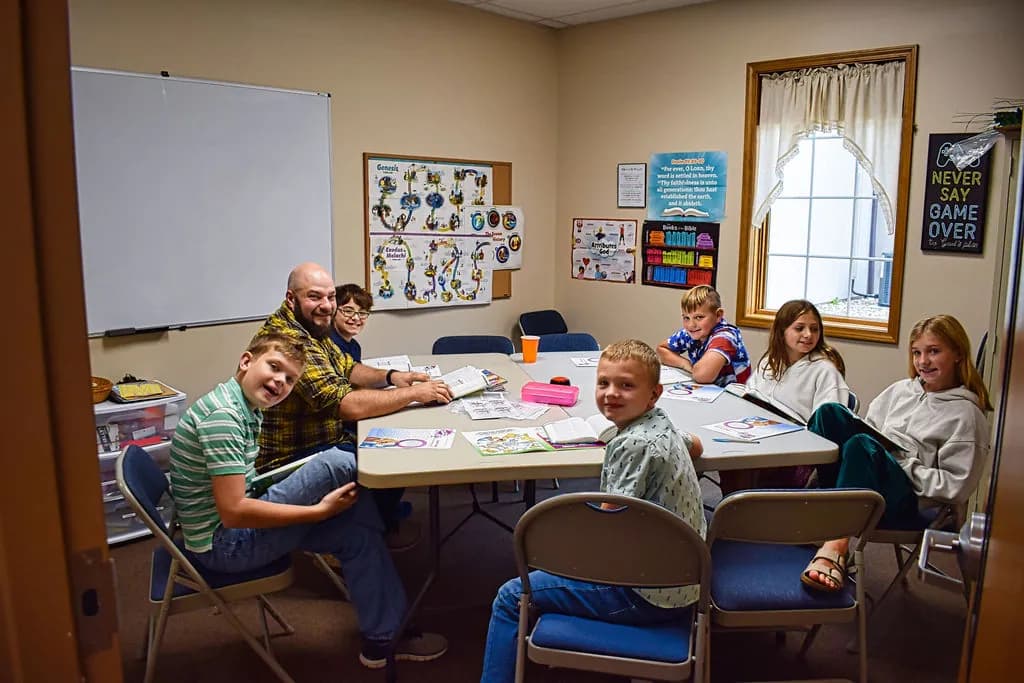 A junior Sunday School class around their table