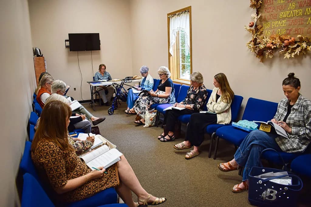 The ladies’ Sunday School class with their Bibles open