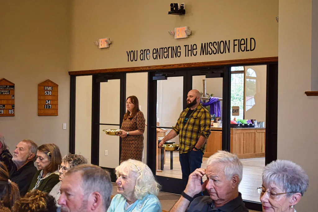 “You are entering the mission field” lettered above the sanctuary exit doors